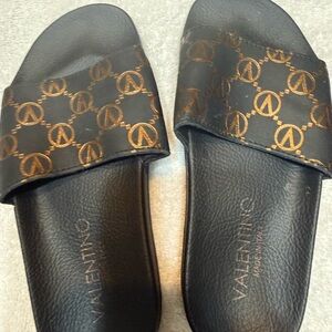 Valentino Black Slides with Gold Logo Pattern